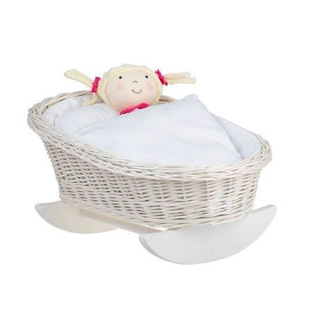 bold statement piece - mimi light wicker rocking cradle with white bedding in dramatic light
