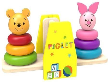 winnie the pooh and piglet wooden stacker with soft morning light on a cozy nursery rug