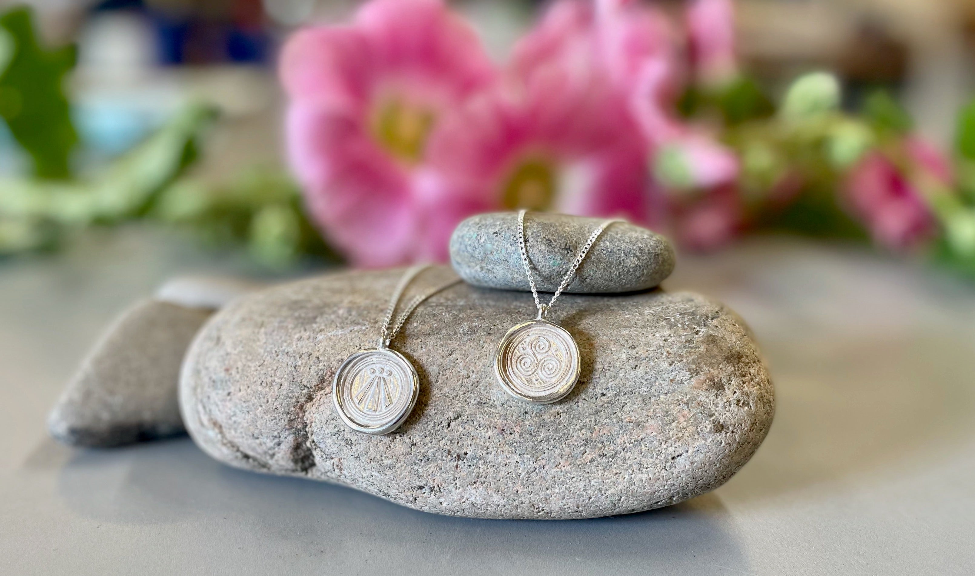 OBOD Store Awen pendant alongside books on modern Druidry