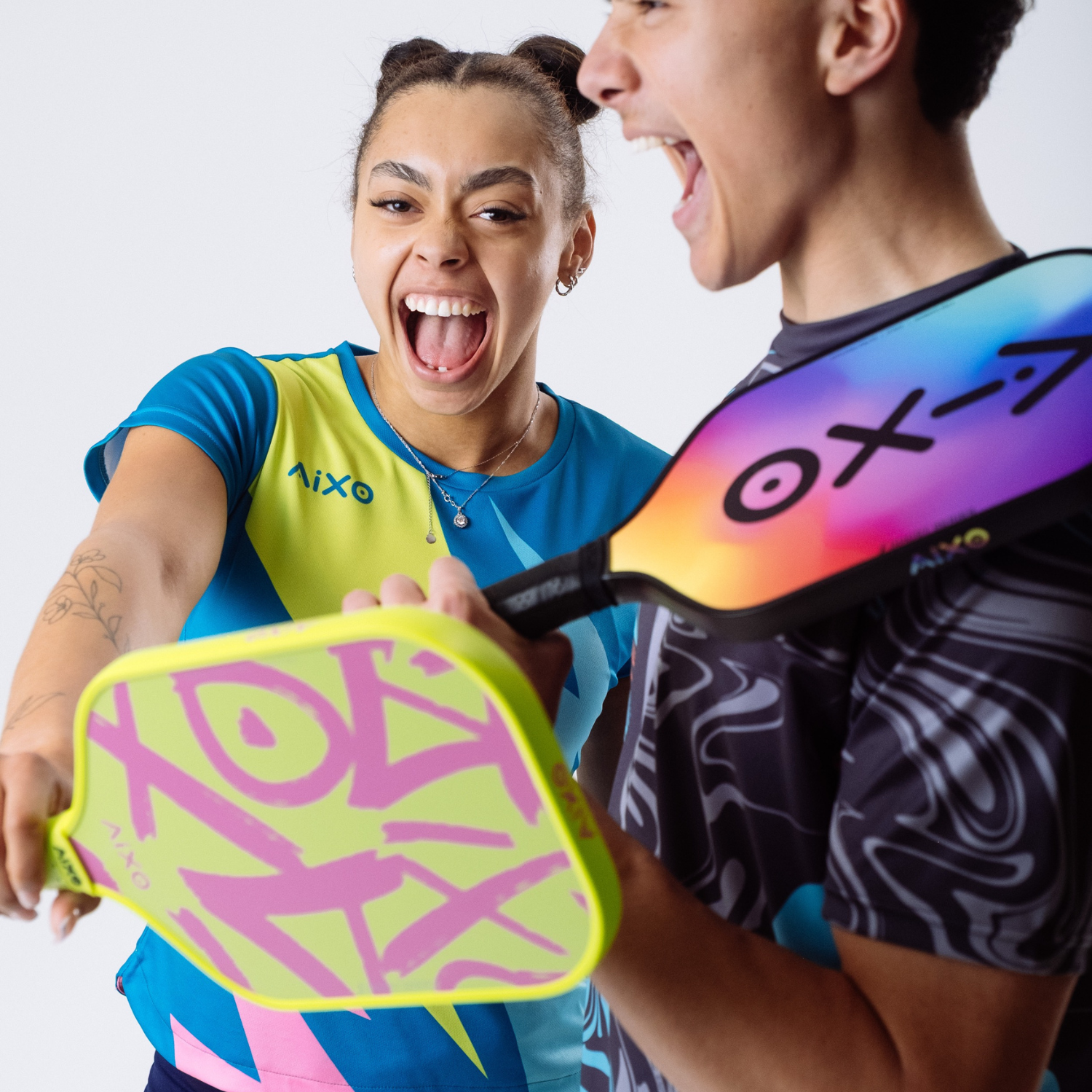 AIXO at Söstter — The Colour Clash Club. UK independent racket sports brand with bold printed grips, properly distinctive sportswear, multi-pack grip bundles, and padel and pickleball gear coming soon.