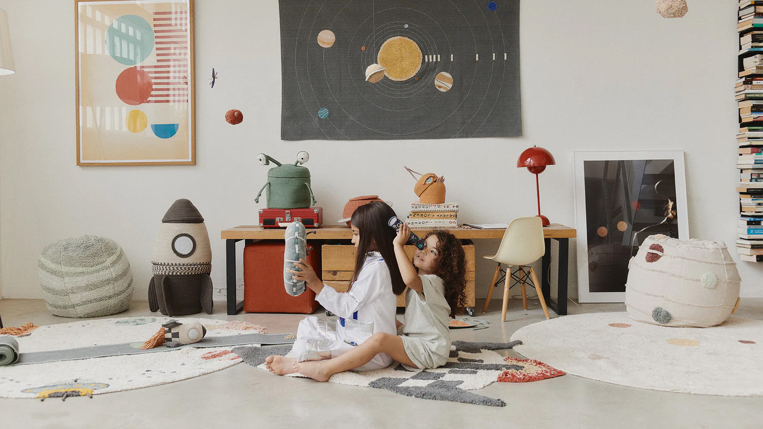 two children in a nursery room of cool quiky furniture and decor on Sostter marketplace
