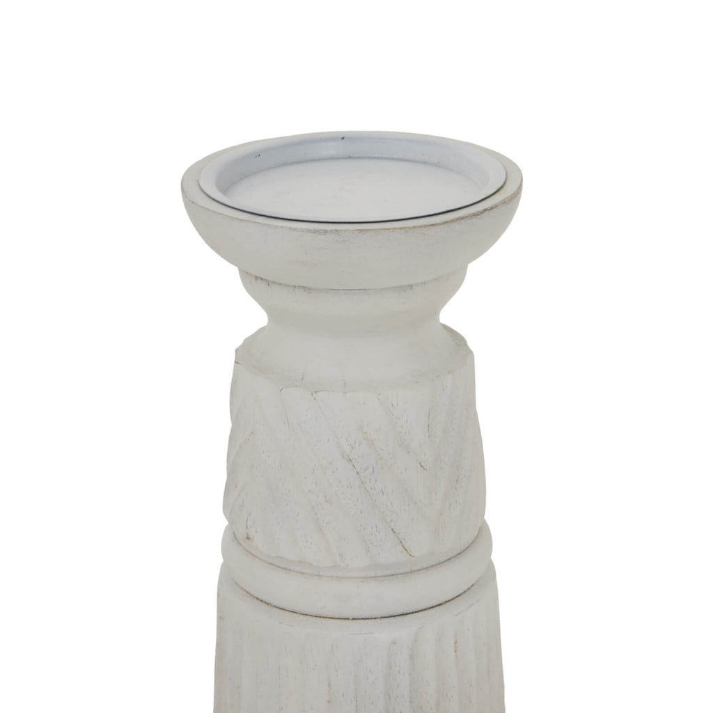 Hand-carved white wood candle holder with geometric patterns, 20cm tall, diffusing soft ambient light. by RoomLondon at brixbailey.com
