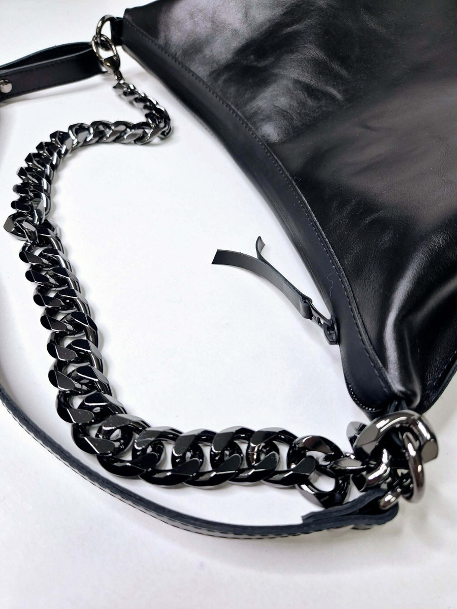 Classic Black Handbag: Timeless Elegance & Modern Features by Zelma Kraft at brixbailey.com