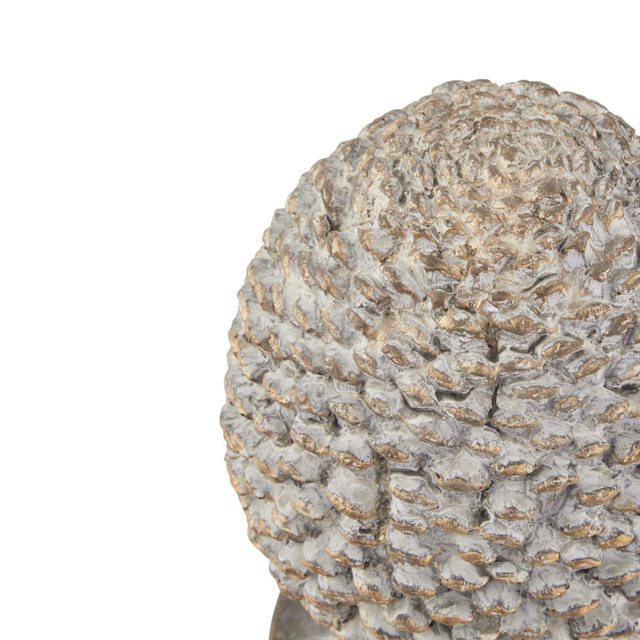 Handcrafted grey stone-effect pinecone ornament with gold metallic accents, 29cm tall, on wooden shelf display by Sostter at brixbailey.com
