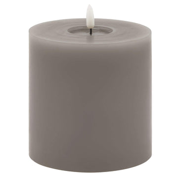 Grey melt-effect LED wax candle with realistic dripping texture and warm flameless glow for ambient lighting by Hill Interiors at brixbailey.com