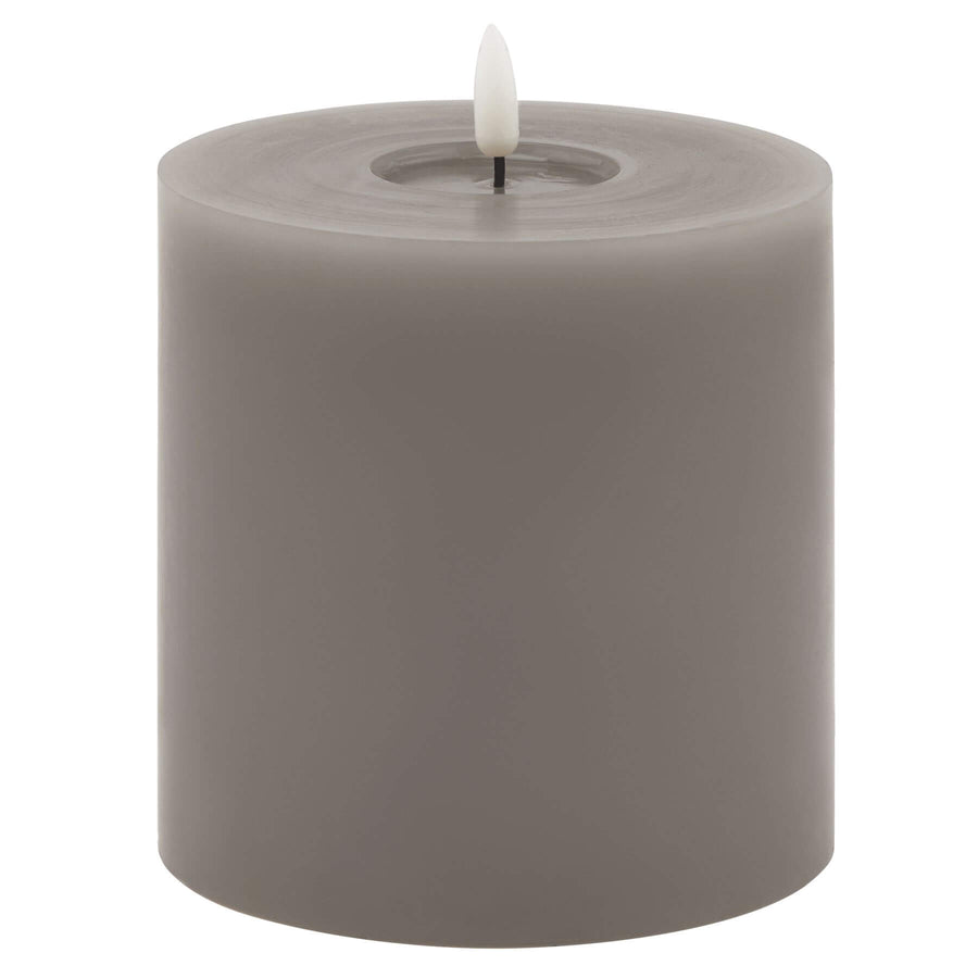 Grey melt-effect LED wax candle with realistic dripping texture and warm flameless glow for ambient lighting by Hill Interiors at brixbailey.com