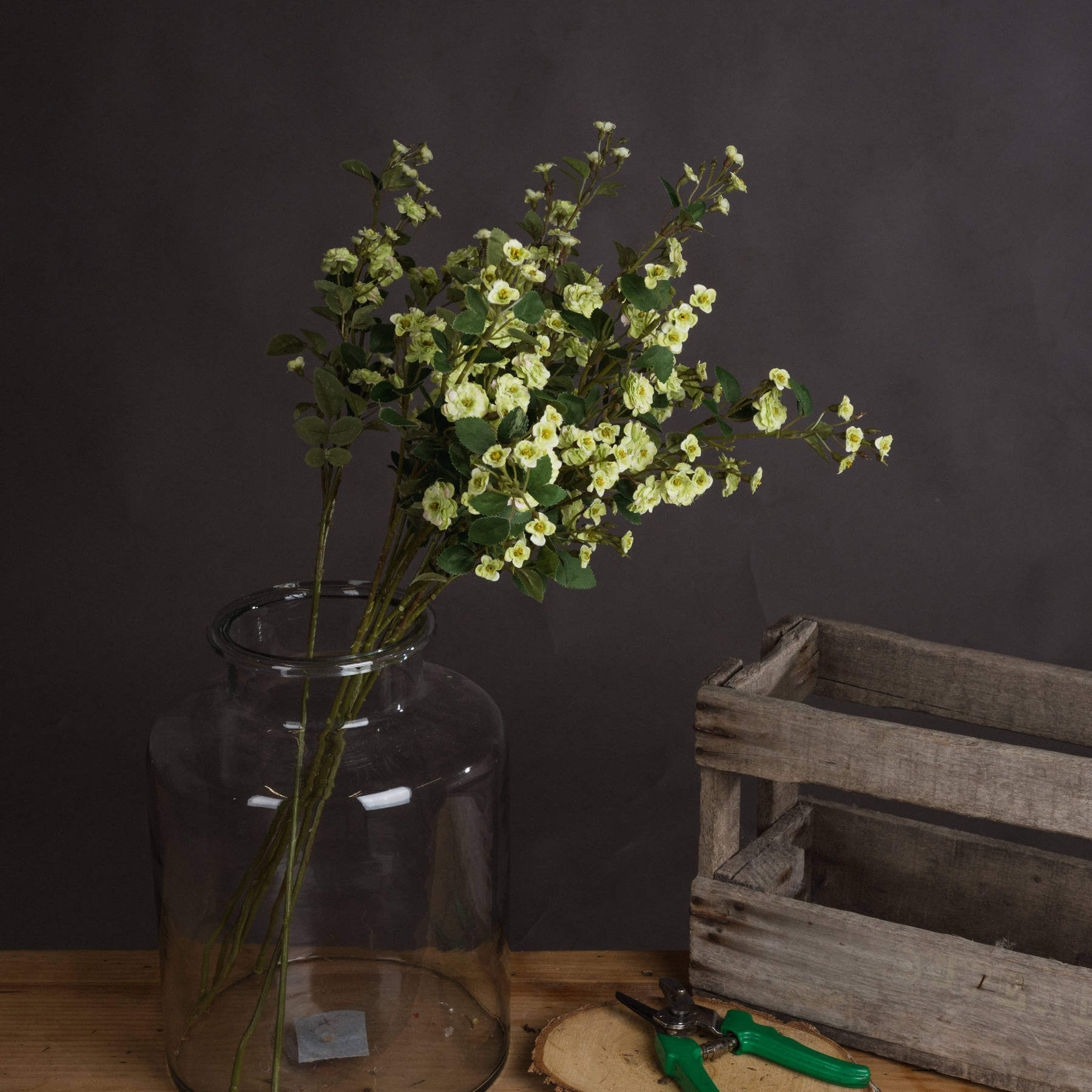 Lifelike artificial meadow rose in rich botanical green, high-quality plastic, 74cm tall, perfect for home decor. by Sostter at brixbailey.com