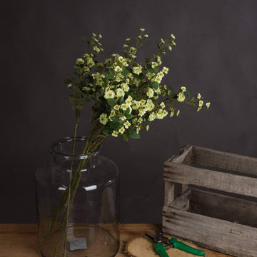 Lifelike artificial meadow rose in rich botanical green, high-quality plastic, 74cm tall, perfect for home decor. by Hill Interiors at brixbailey.com