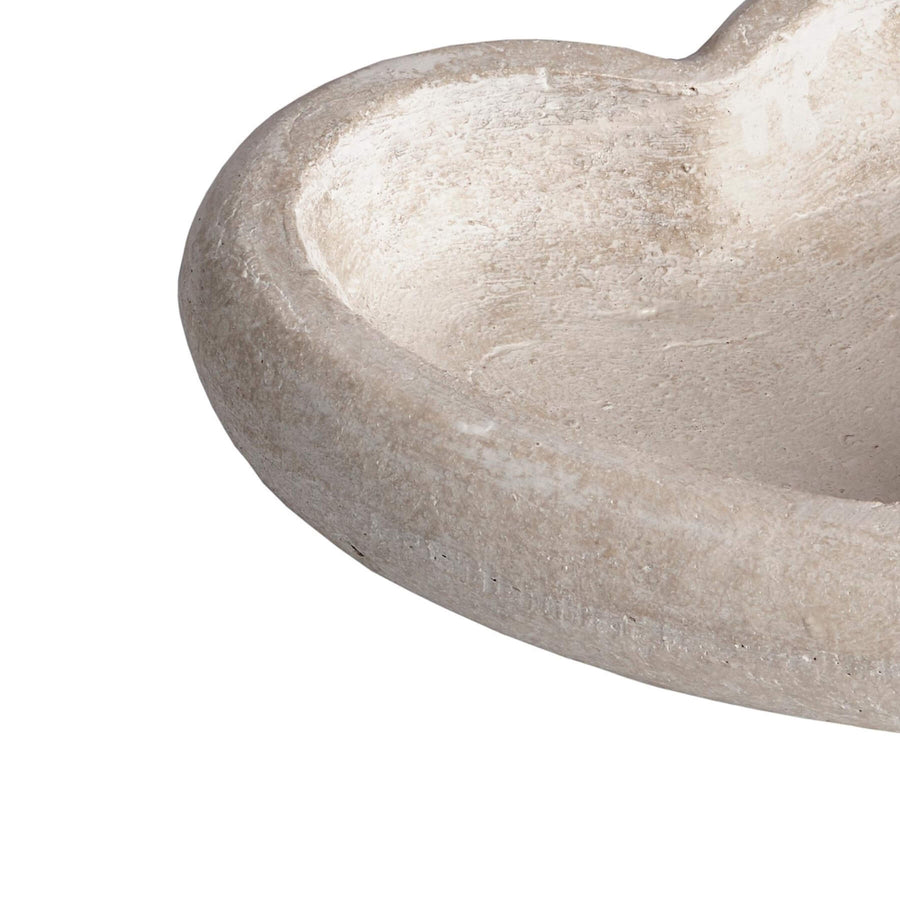 Handcrafted cream stone heart dish with antiqued finish, rustic texture, and deep well for decor or display. by Sostter at brixbailey.com