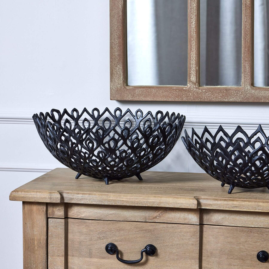 Matt black aluminum lattice bowl with geometric perforations, modern sculptural centerpiece for interior decor by Sostter at brixbailey.com
