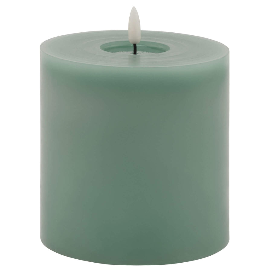 Sage green LED wax candle with realistic melting effect, flameless and energy-efficient for warm ambiance by Sostter at brixbailey.com
