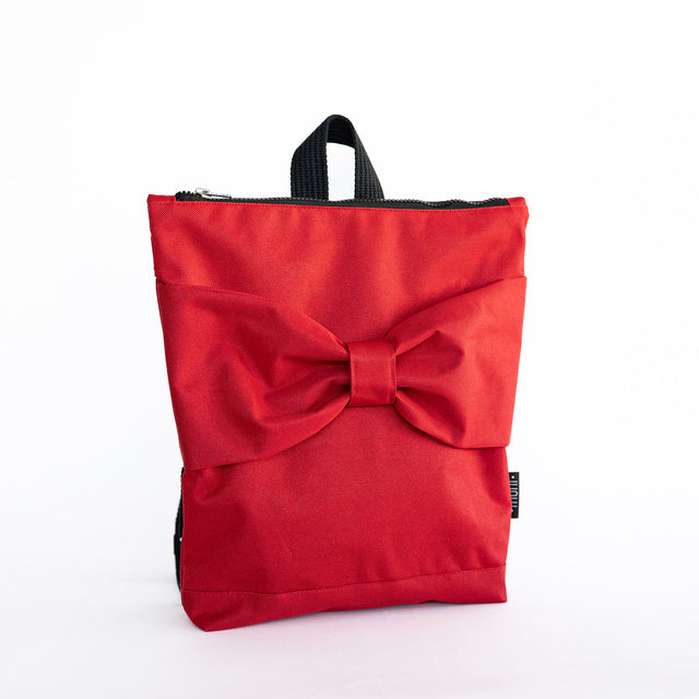 Red Bow Backpack for Kids – Waterproof & Playful Design by Muni at www.brixbailey.com