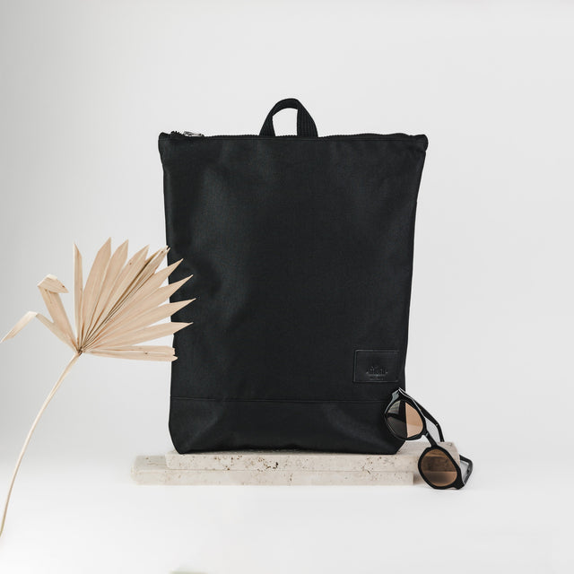 Waterproof Black Leather Backpack – Chic & Functional by Muni at brixbailey.com