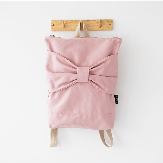 Chic Pink Bow Backpack – Whimsical & Spacious Design by Muni at brixbailey.com