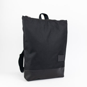 Chic Waterproof Black Leather Backpack – Stylish & Functional by Muni at brixbailey.com