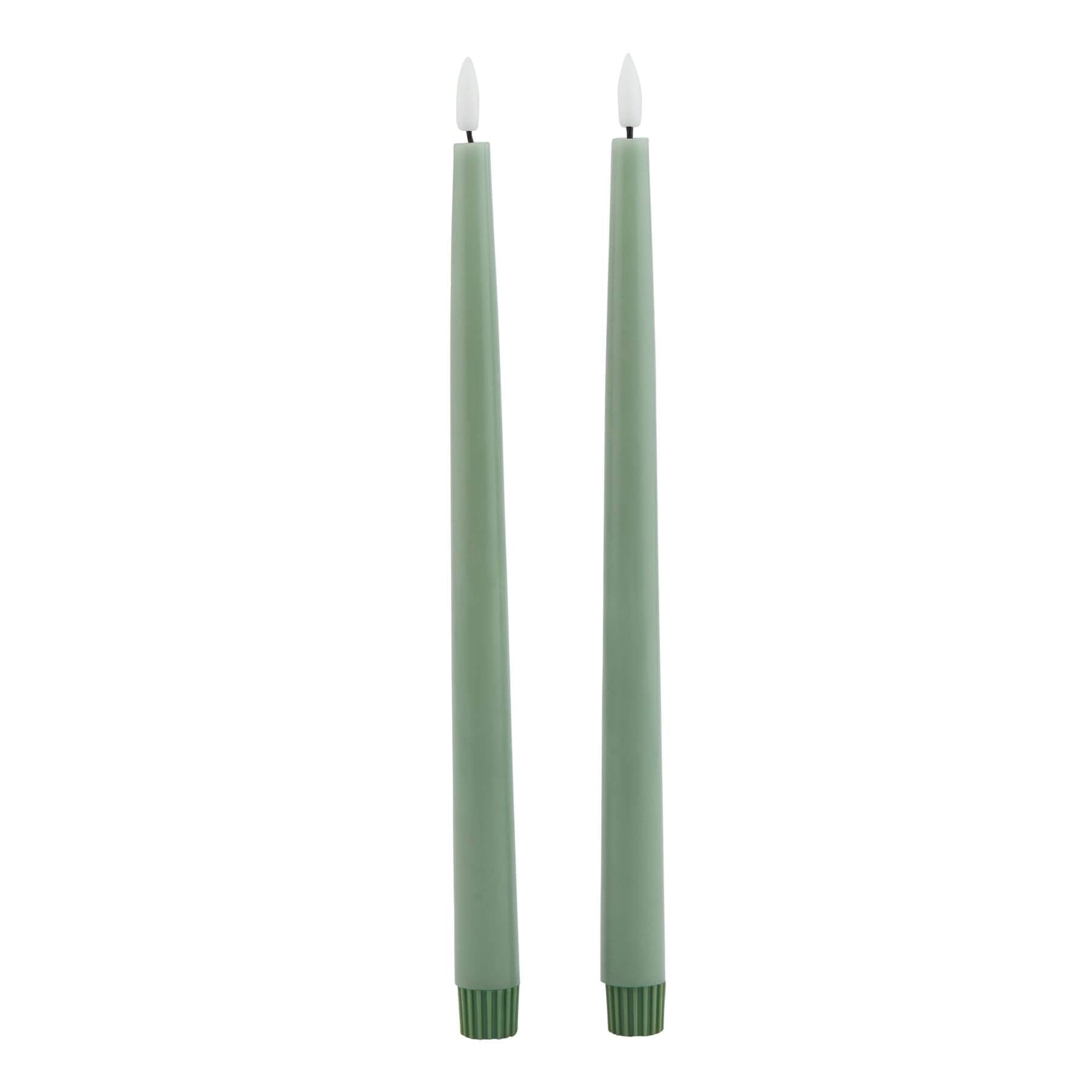 Sage green LED candle with realistic wax texture and flickering glow, 25 cm tall, flame-free ambiance for home decor. by RoomLondon at brixbailey.com