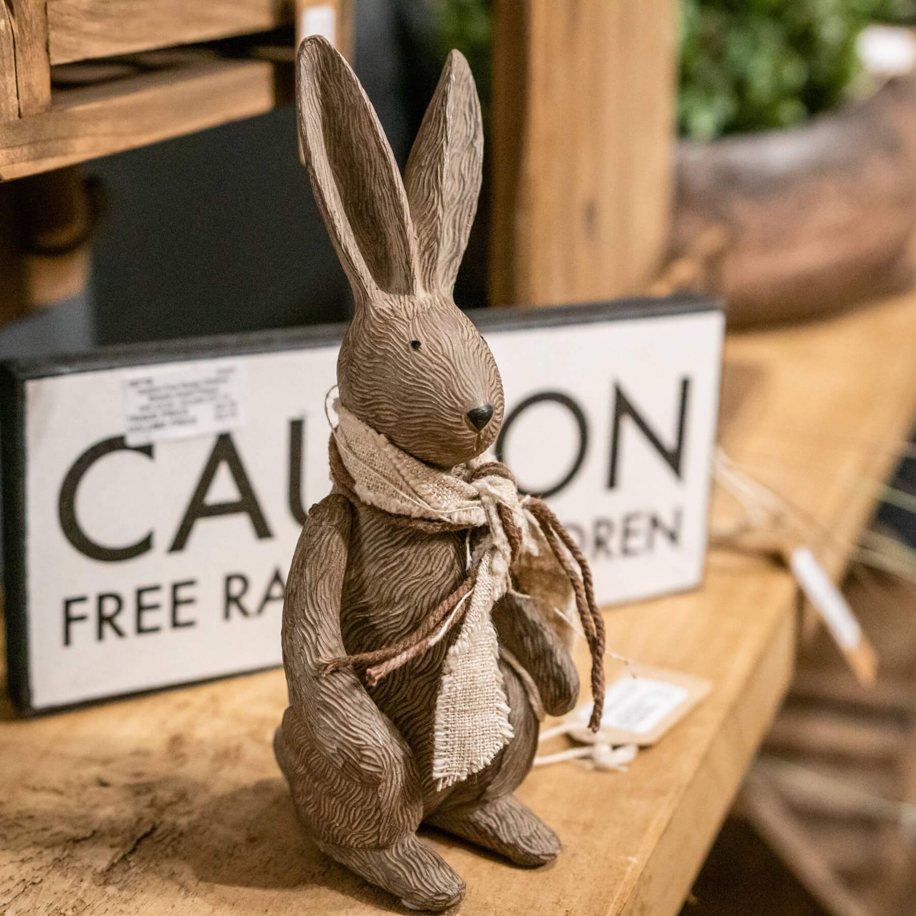 Handcrafted winter bunny figurine with fabric scarf, warm brown resin decor for shelves or mantels by Sostter at brixbailey.com