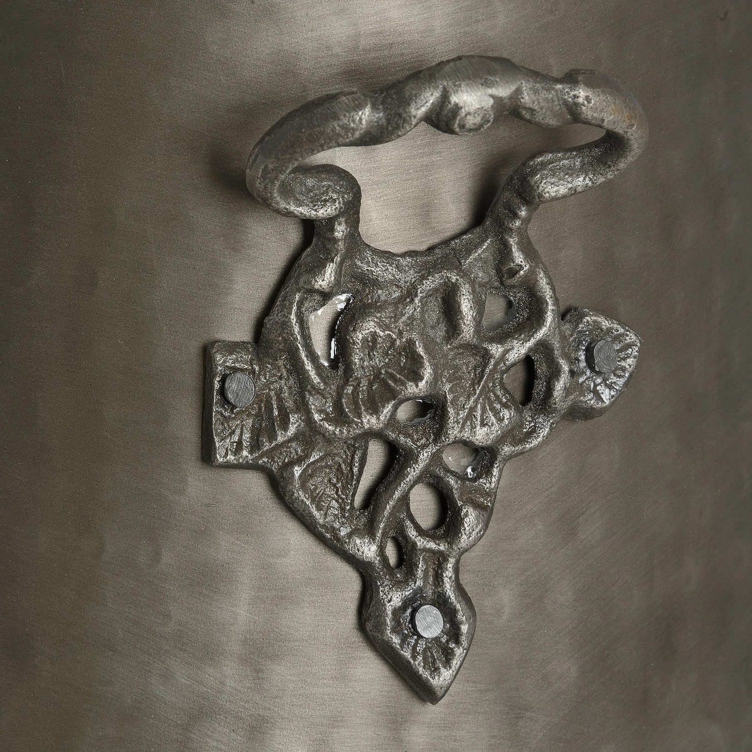 Handcrafted antique pewter coal bucket with gunmetal finish, intricate leaf motifs, and elegant curves for home decor. by Sostter at brixbailey.com