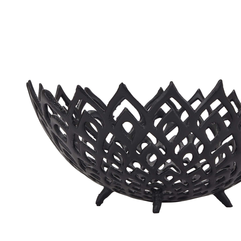 Black perforated steel lattice bowl casting intricate light patterns, modern matte home decor centerpiece by Sostter at brixbailey.com