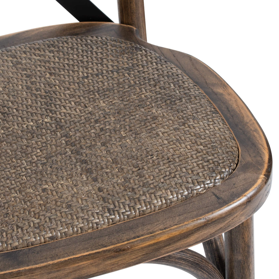 Elm cross-back dining chair with handwoven rush seat and black metal accents, warm brown finish by Sostter at brixbailey.com