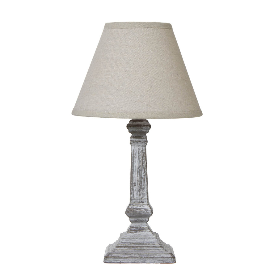 Distressed wood column table lamp with linen shade in elegant grey, perfect for farmhouse or modern decor.  by Sostter at brixbailey.com