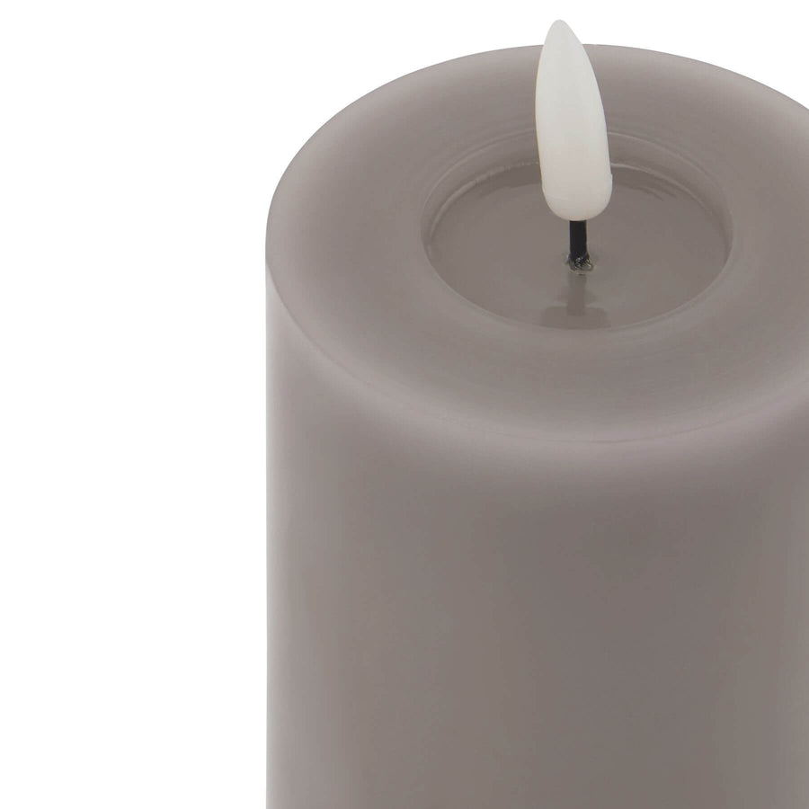 Grey LED wax candle with realistic flicker effect, battery-operated for safe ambient lighting by Sostter at brixbailey.com
