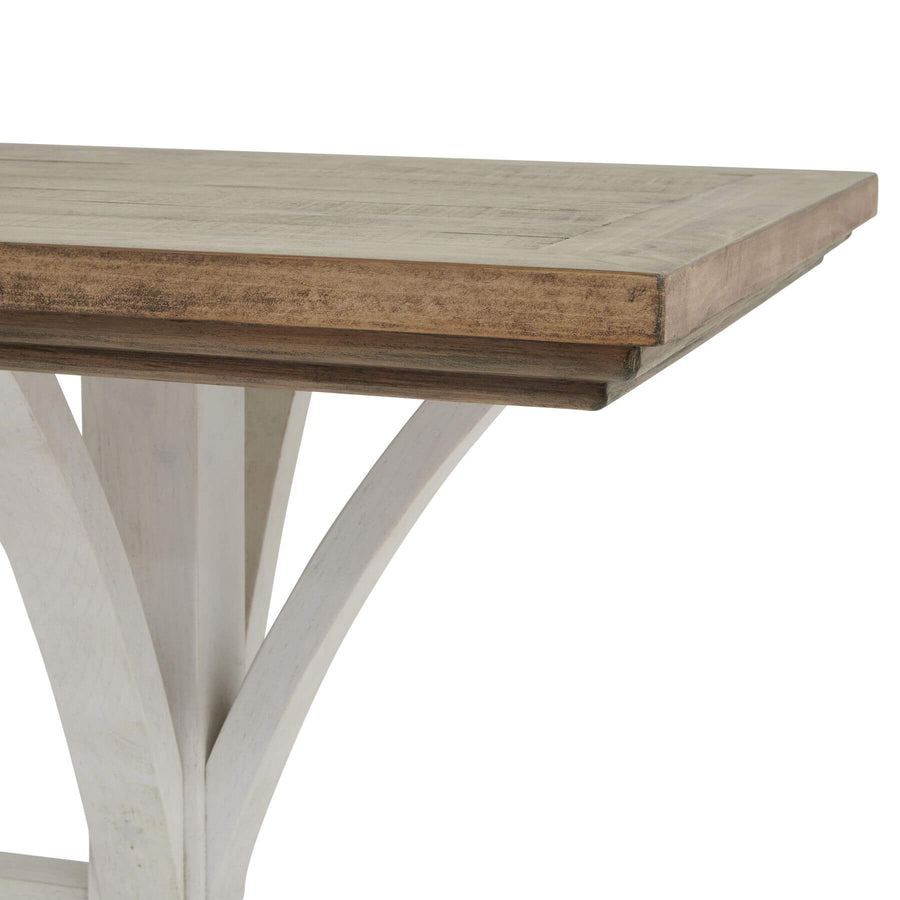 Handcrafted pine bar table with white base, rustic-modern style, showcasing natural wood grain for dining or entertaining. by Sostter at brixbailey.com