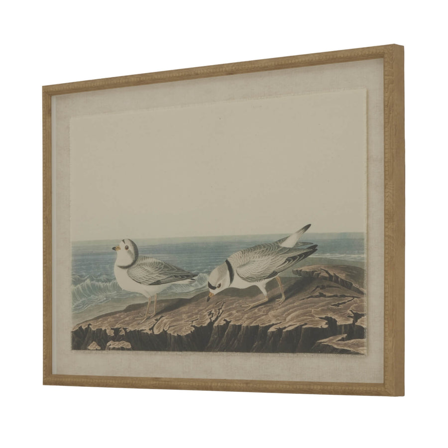 Handcrafted linen wall art with shorebird design, earthy brown tones, and ornate beaded border for coastal-inspired decor. by Sostter at brixbailey.com