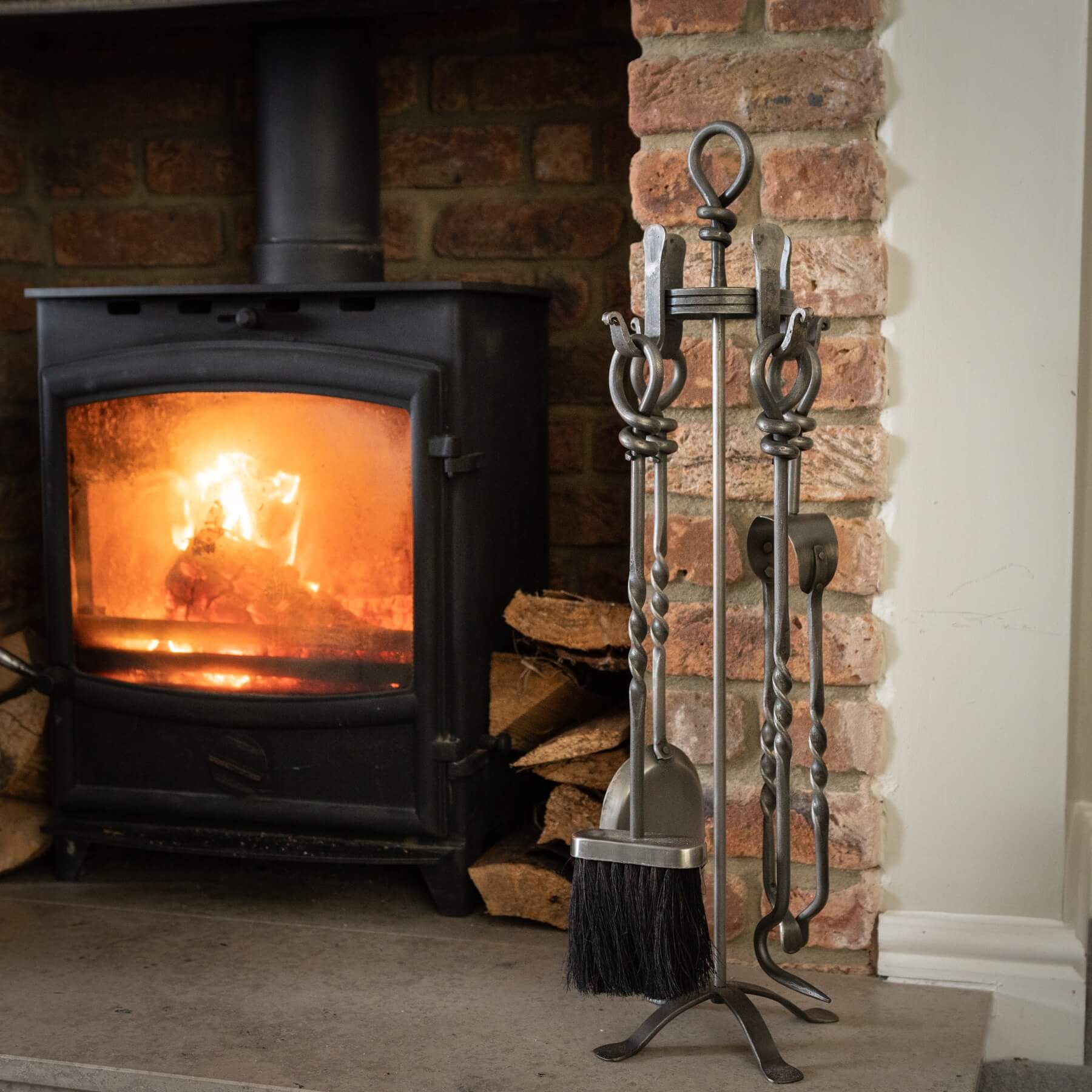 Hand-turned pewter fireplace set with poker, shovel, brush, and tongs on weighted stand, polished nickel alloy finish. by Sostter at brixbailey.com