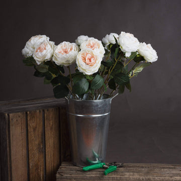 Lifelike white artificial Austin rose with blush center, realistic petals and stem, perfect for weddings and home decor by Sostter at brixbailey.com