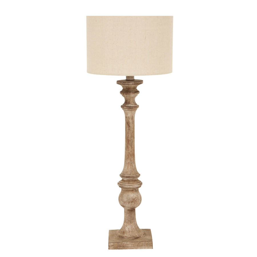 Brown metallic candlestick table lamp with linen shade for warm ambient lighting by Sostter at brixbailey.com