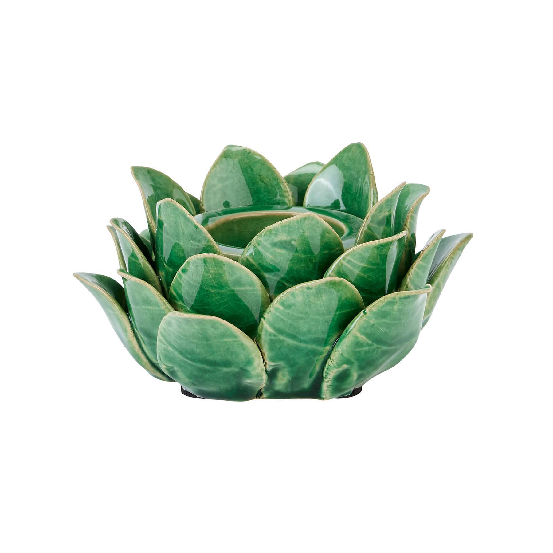 Handcrafted ceramic tea light holder in botanical green with artichoke cutouts, casting intricate shadow patterns. by RoomLondon at brixbailey.com