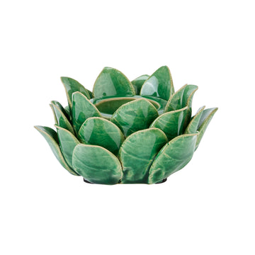 Handcrafted ceramic tea light holder in botanical green with artichoke cutouts, casting intricate shadow patterns. by Sostter at brixbailey.com