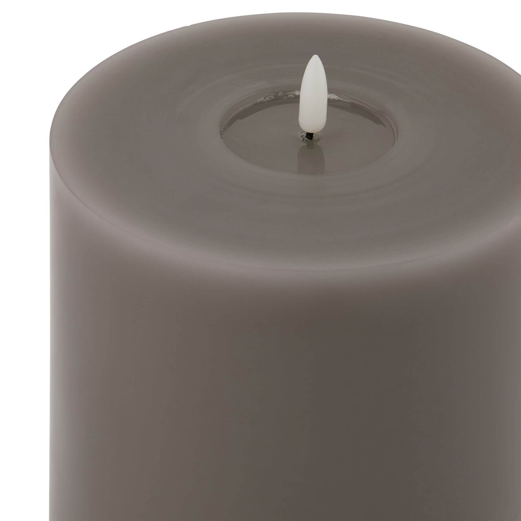 Grey LED wax candle with realistic melt effect and flickering light for flame-free ambiance by Sostter at brixbailey.com