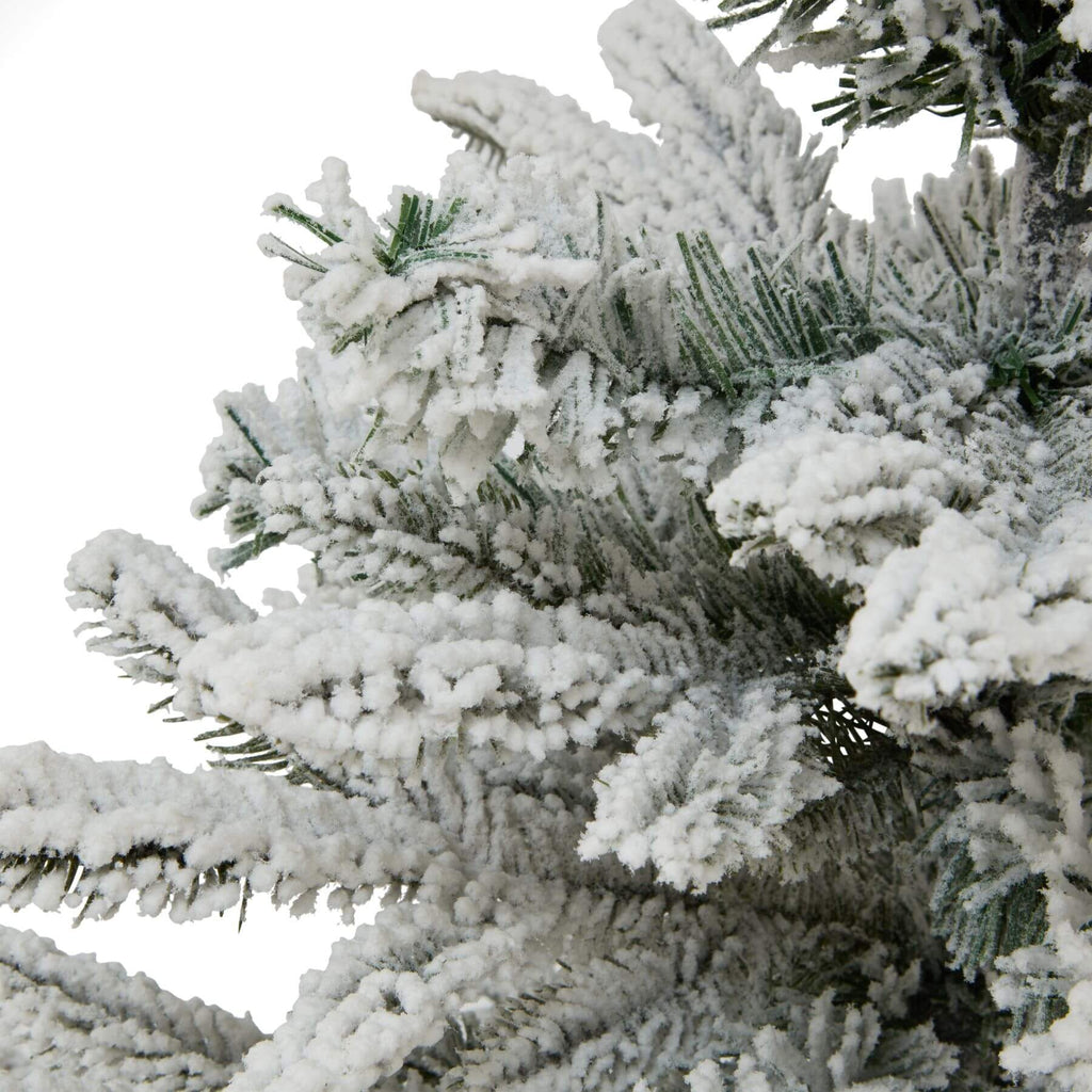 Medium snowy spruce tree with frosted branches and rustic burlap base, perfect for winter decor and holiday displays. by Sostter at brixbailey.com