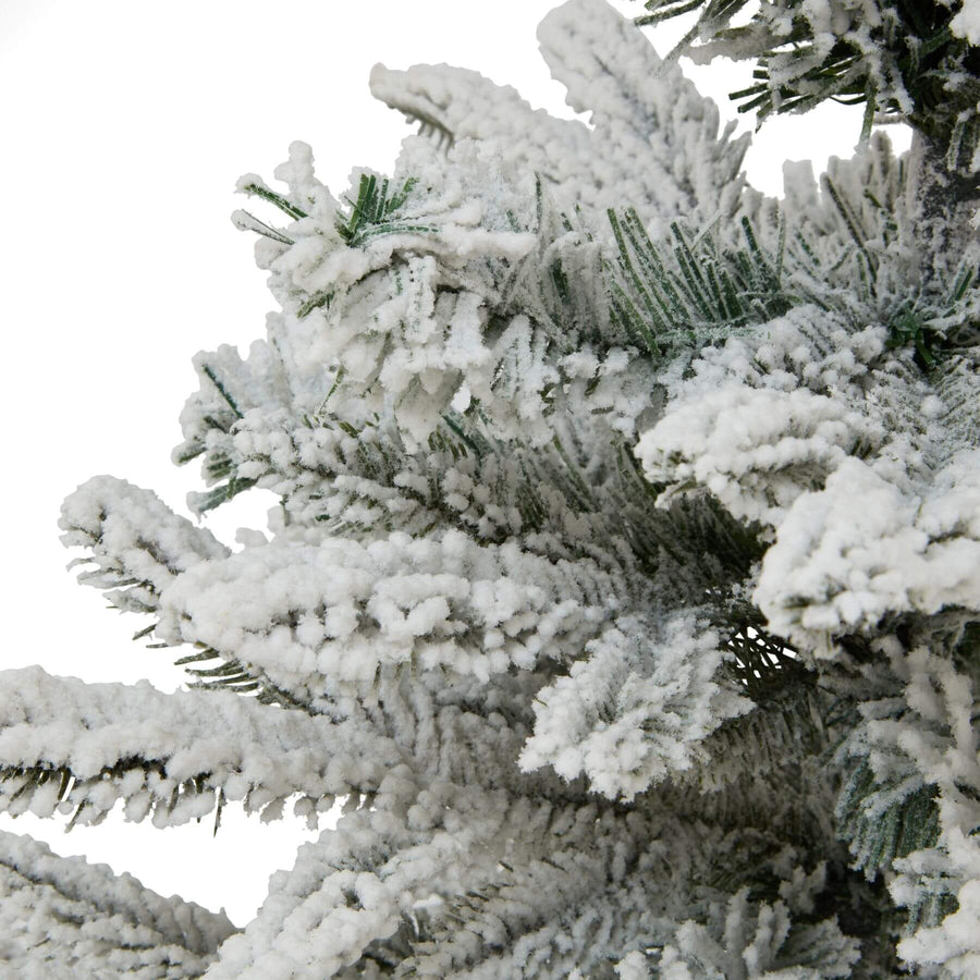 Medium snowy spruce tree with frosted branches and rustic burlap base, perfect for winter decor and holiday displays. by Sostter at brixbailey.com