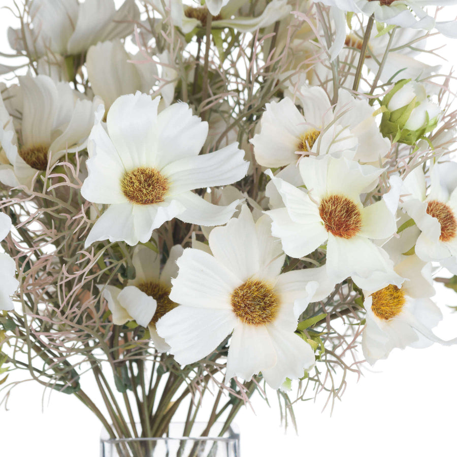 Lifelike cream cosmos spray with wispy foliage, 36cm tall, perfect for year-round floral arrangements. by Sostter at brixbailey.com