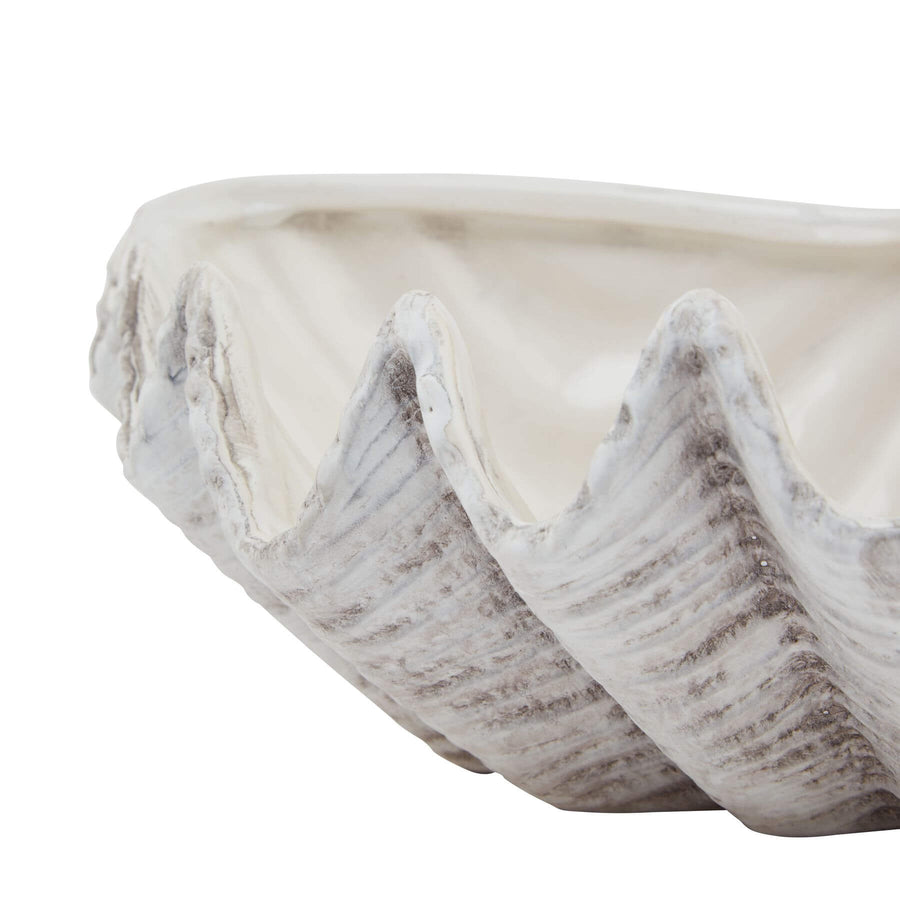 Handcrafted white ceramic shell bowl with organic spiral design and matte finish for coastal home decor. by Sostter at brixbailey.com