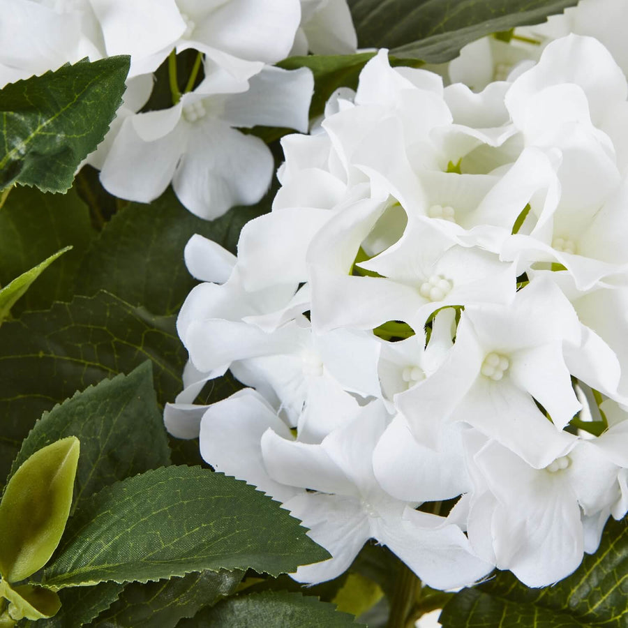 White hydrangea arrangement with green foliage, lifelike plastic blooms, perfect for farmhouse or modern decor by Sostter at brixbailey.com