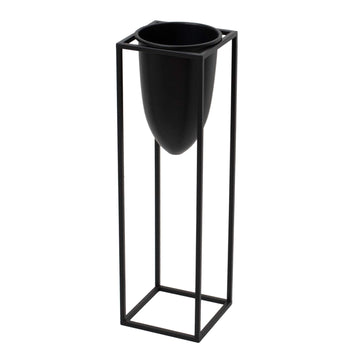 Matte black industrial modern metal planter with sleek bullet design, 62cm tall, for minimalist interiors. by Sostter at brixbailey.com