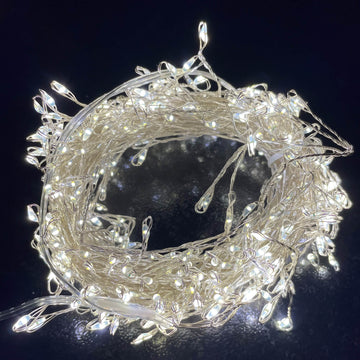 400-LED warm white micro string lights draped in cozy holiday decor, 23.6 feet long on silver wire by Hill Interiors at brixbailey.com