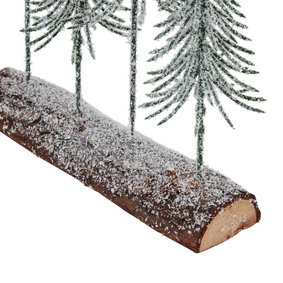 Miniature winter forest display with four snow-dusted spindle trees on rustic wood log base, natural brown and white accents by Sostter at brixbailey.com