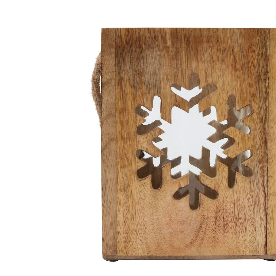Handcrafted wooden snowflake tealight holder with intricate design, natural wood tones, and glass components for cozy winter decor. by Sostter at brixbailey.com