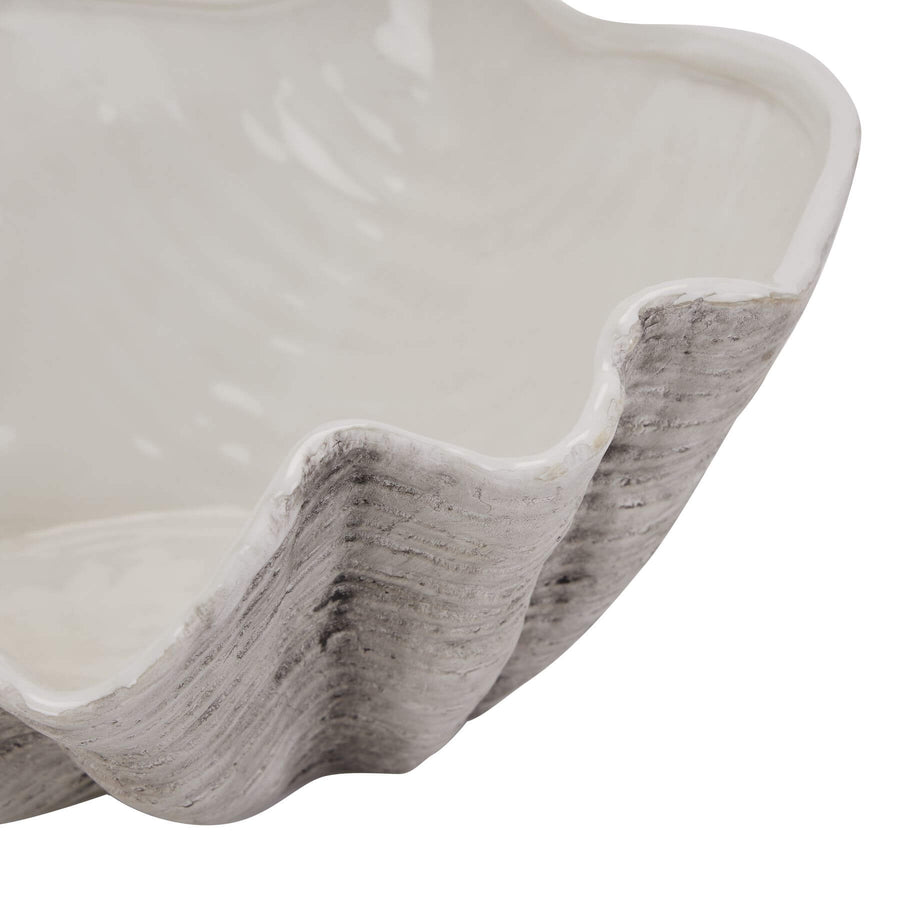 Handcrafted white ceramic shell bowl with artisanal texture, perfect for coastal decor or floral displays. by Sostter at brixbailey.com