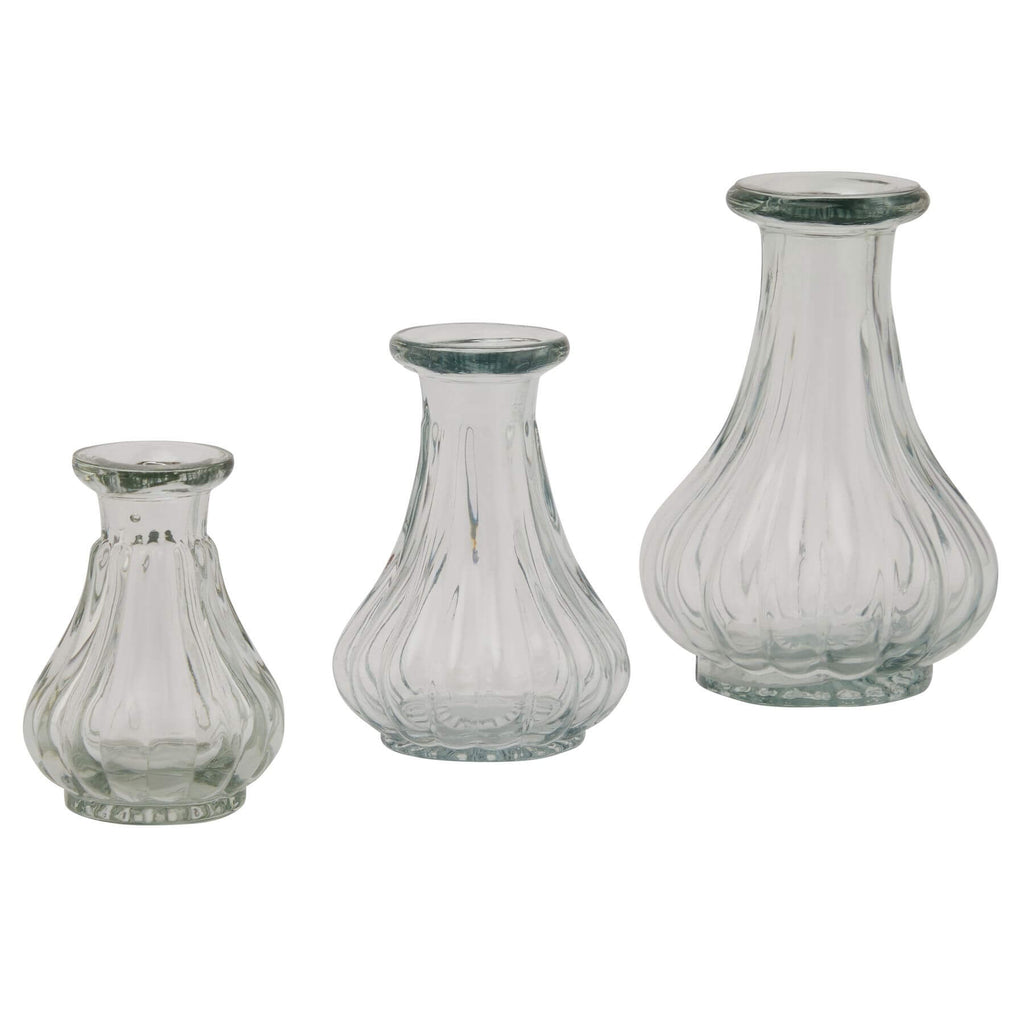 Clear glass bud vase for single stems, minimalist cylindrical design, 8cm height, perfect for modern decor by Sostter at brixbailey.com