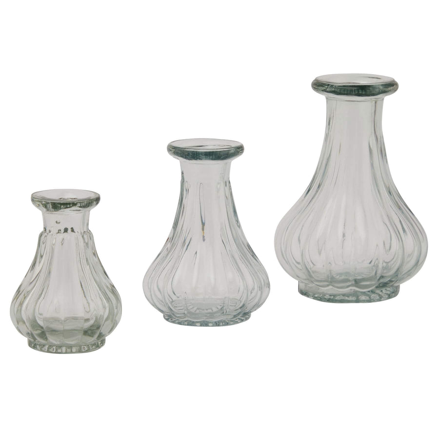 Clear glass bud vase for single stems, minimalist cylindrical design, 8cm height, perfect for modern decor by Sostter at brixbailey.com