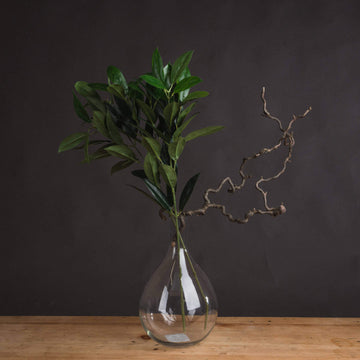 Lifelike faux bay leaf spray with emerald green leaves, 75cm tall, for Mediterranean decor by Sostter at brixbailey.com