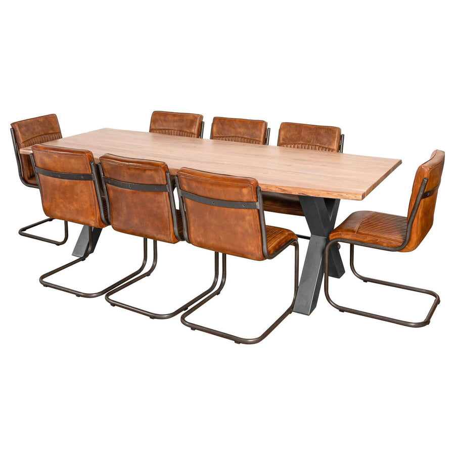 Handcrafted acacia wood dining table with live edges and metal cross-frame base, seats 8 in natural brown and grey tones. by Sostter at brixbailey.com
