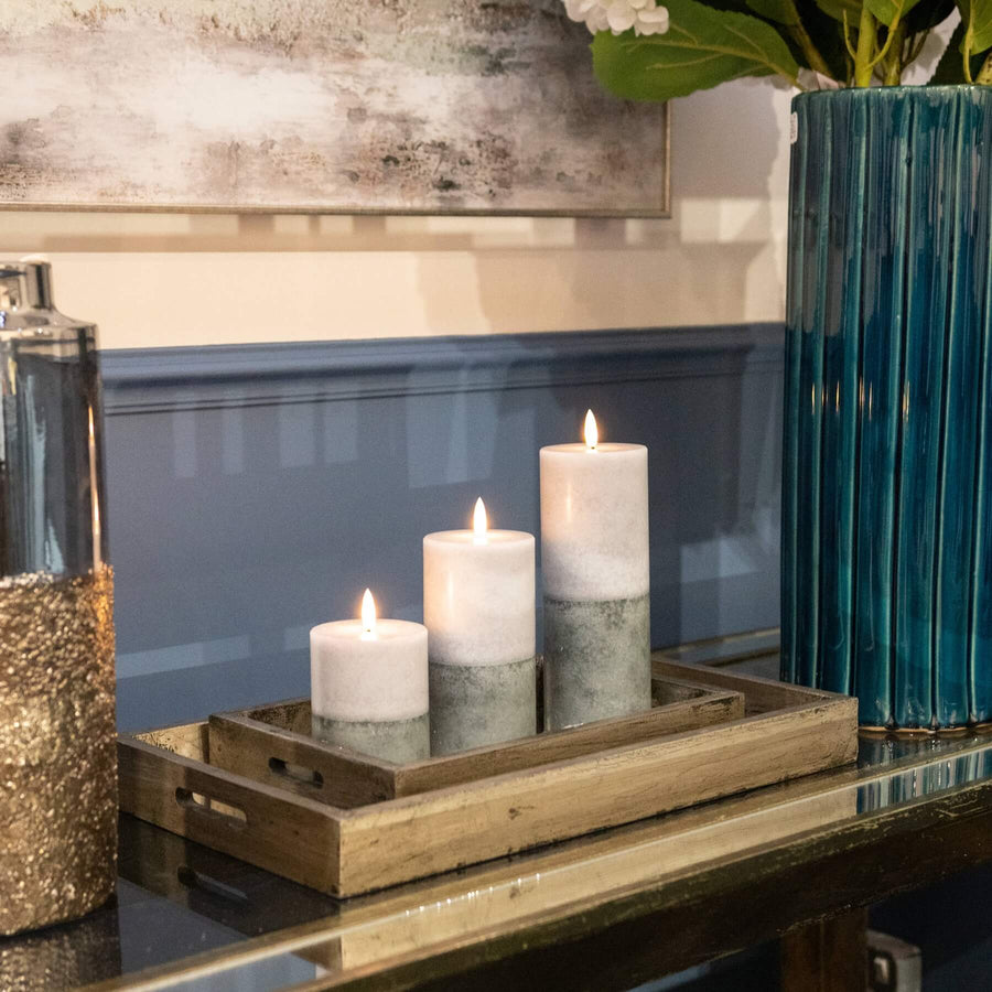 Premium LED candle with warm amber flicker, natural stone finish, and realistic two-tone texture for elegant decor. by Hill Interiors at brixbailey.com