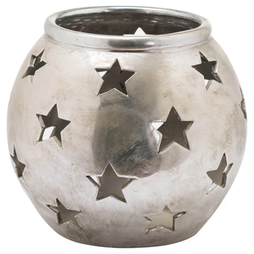 Silver ceramic tea light lantern with star cutouts casting patterned shadows, modern geometric decor  by Sostter at brixbailey.com